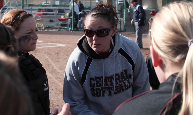 Holtman-Fletcher (center) is now the head softball coach at her alma mater after a storied playing career.